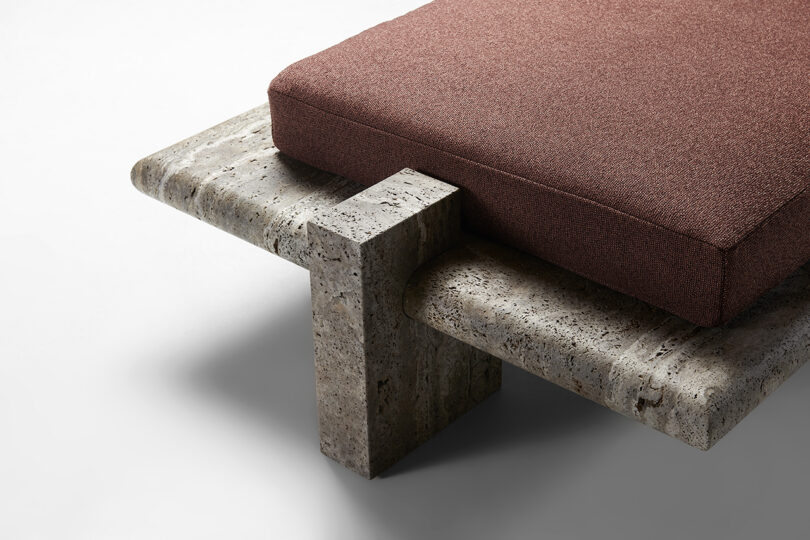 detail of modern marble chaise lounge with brown upholstery