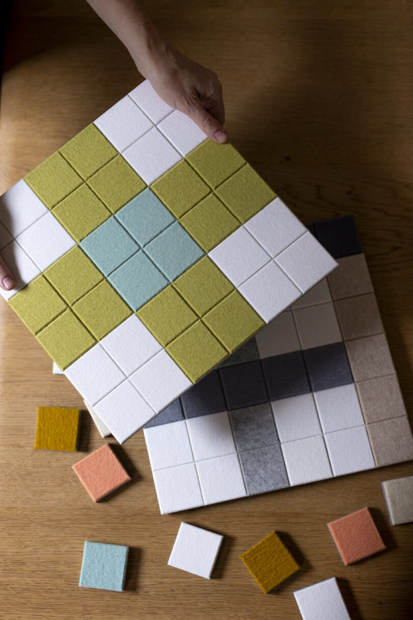 squares of colorful felt acoustic wall tiles