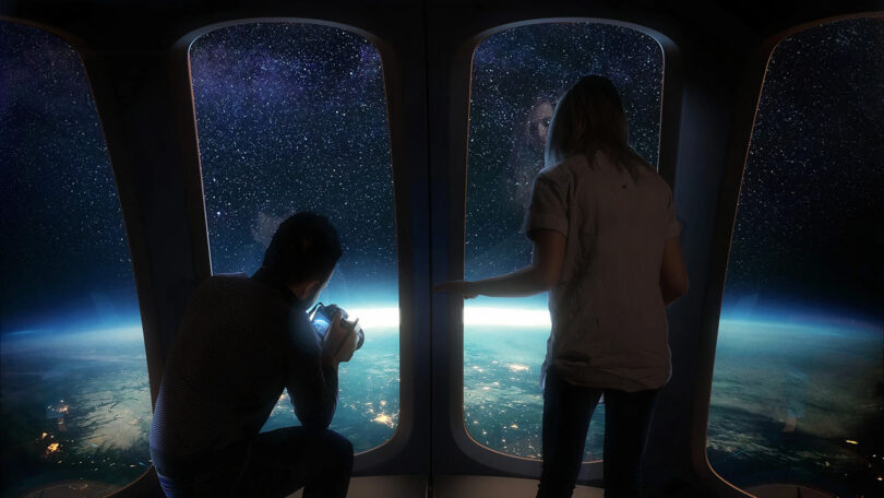 Two people looking out the window of the spacecraft onto the surface of Earth, part of the world’s first luxury spaceflight service.