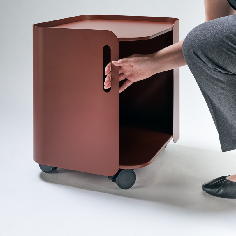 Rust modern office storage cart with a sleek design, featuring wheels for mobility.