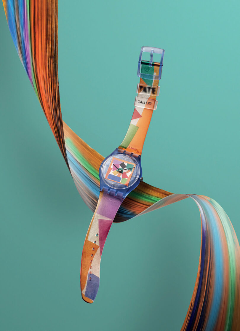 A colorful Swatch x Tate Gallery Watch Collection piece with an artistic strap design, presented against a backdrop of flowing, ribbon-like shapes.