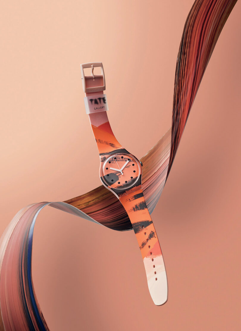 An orange, black and white Swatch x Tate Gallery Watch Collection wristwatch with an artistic design suspended against a swirling abstract background.