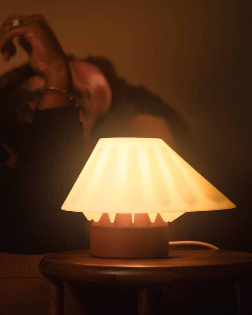 A nightstand with a lamp