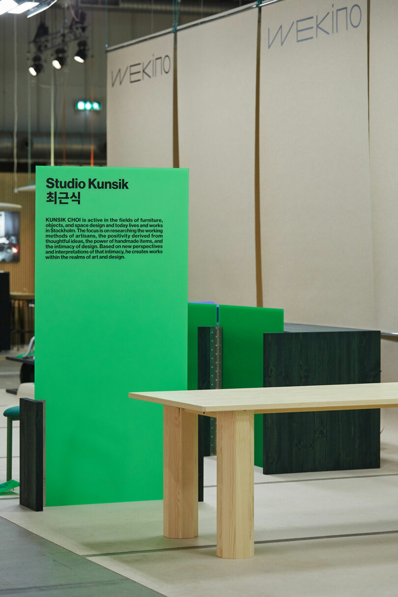 A table and chairs on display at an exhibition.