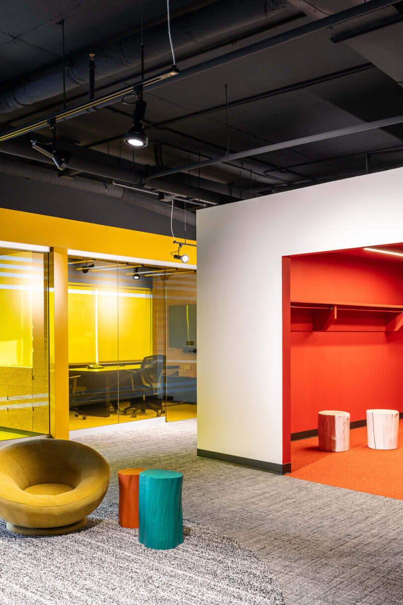 An office with colorful walls and chairs.