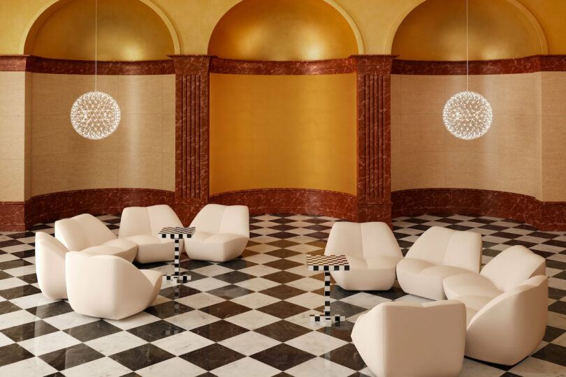 white lounge chairs in a room with black and white checkered floor