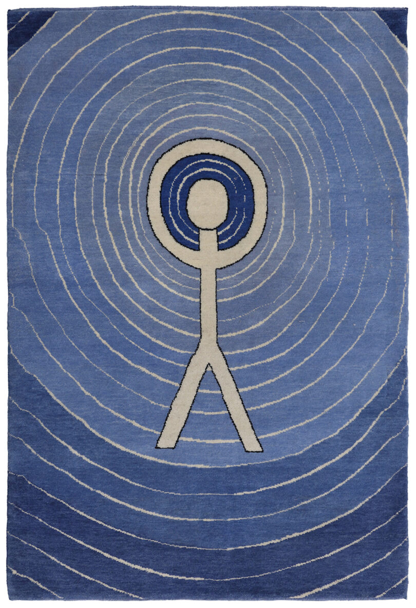 blue rug with radiating lines and a white figure