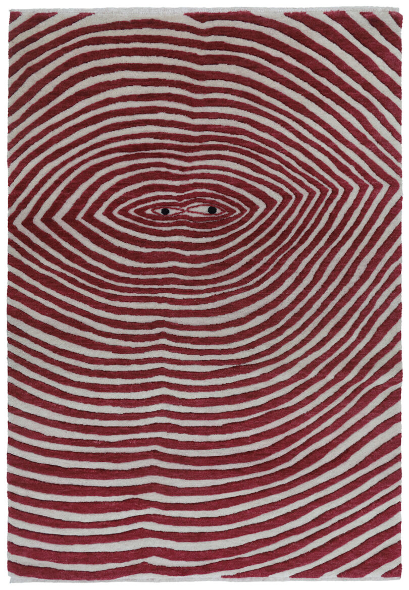 red and white rug with radiating lines