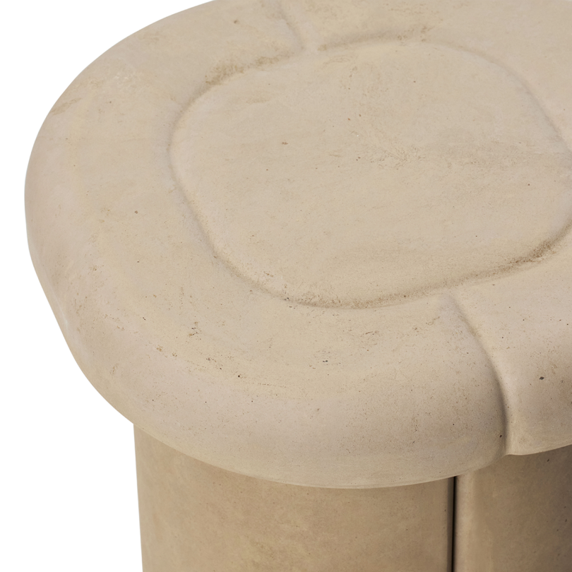 Detail of beige stool.