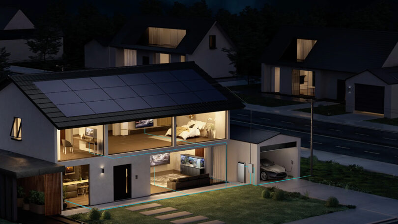 Nighttime view of modern suburban homes with solar panels and an Anker SOLIX X1 residential battery, showcasing illuminated interiors and an electric car charging.