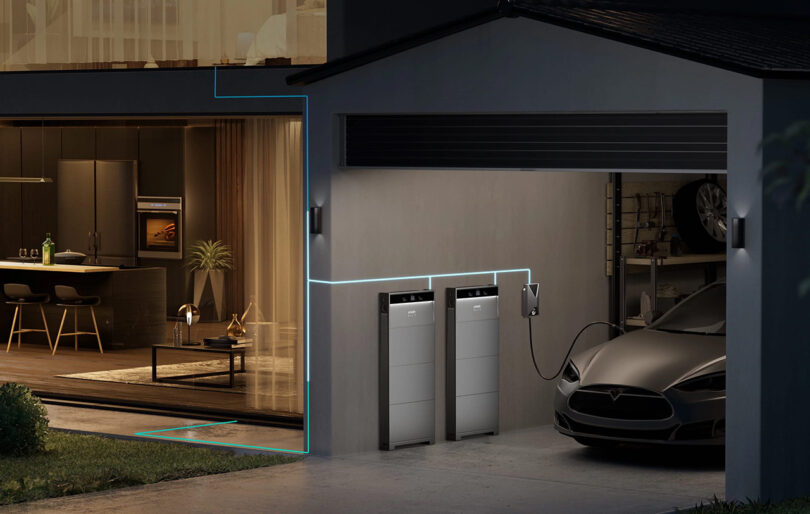 Modern home garage with an Anker SOLIX X1 residential battery and an electric car charging next to storage units, interior view into a stylish kitchen and living area.
