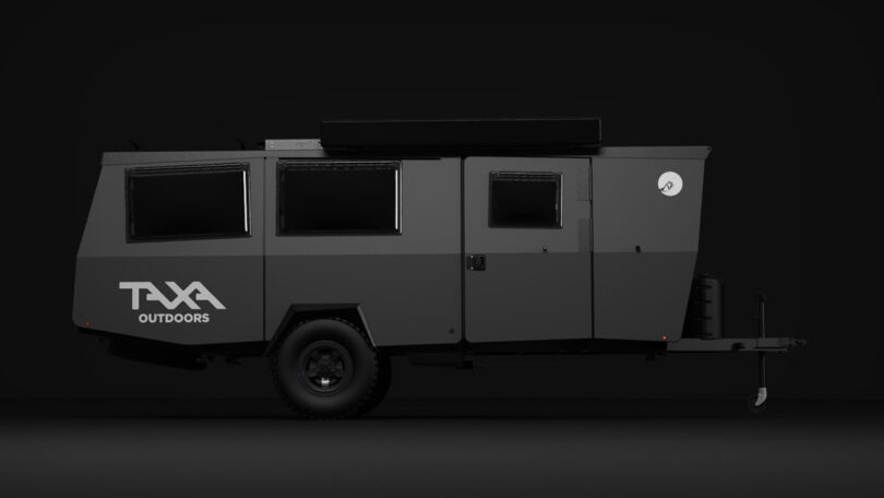All matte black exterior Dark Sky Mantis adventure trailer parked against a dark background.