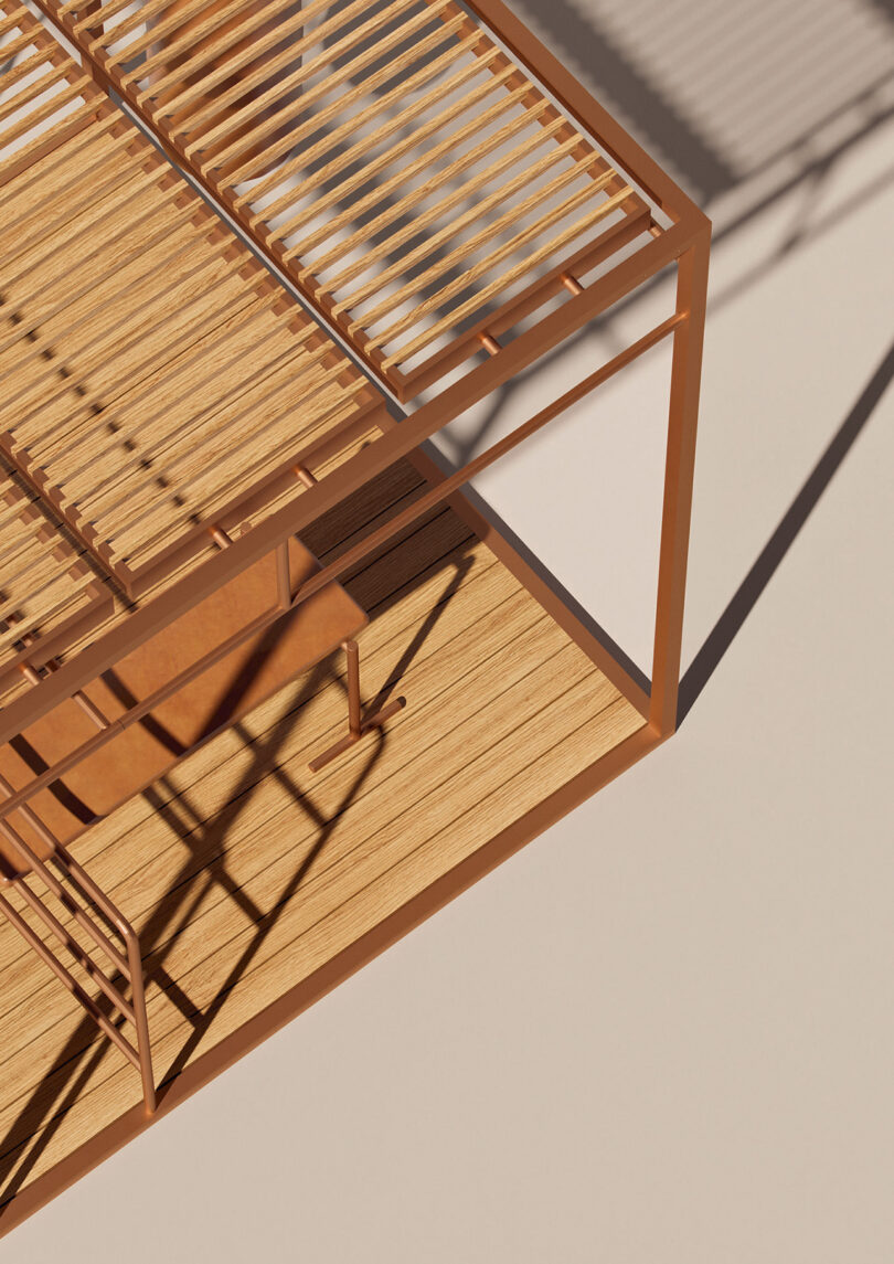 A modern teak slat and metal OUT-FIT outdoor gym structure casting a shadow on a wooden floor in bright sunlight viewed from an angled overhead perspective.