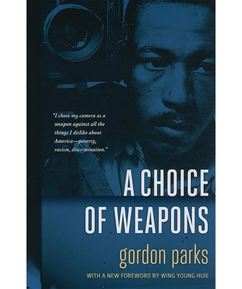 Book cover of "a choice of weapons" by gordon parks featuring a close-up of the author's face with a camera in the background and a quote about using his camera against social ills.