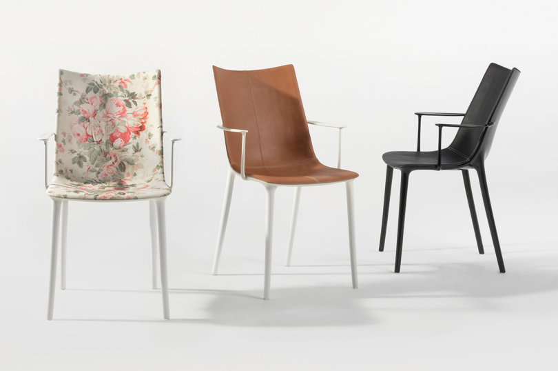 Three contemporary chairs with different designs and upholstery, isolated on a white background.