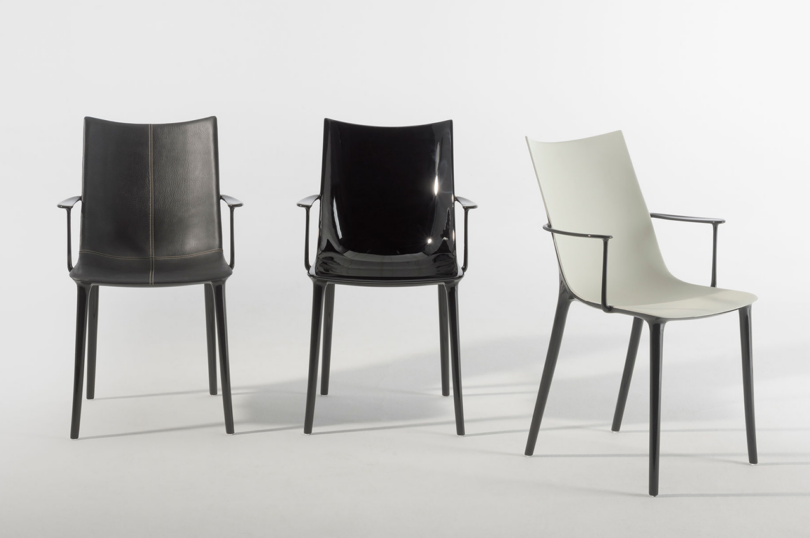 Three modern chairs with varying designs and colors, aligned side by side on a simple background.