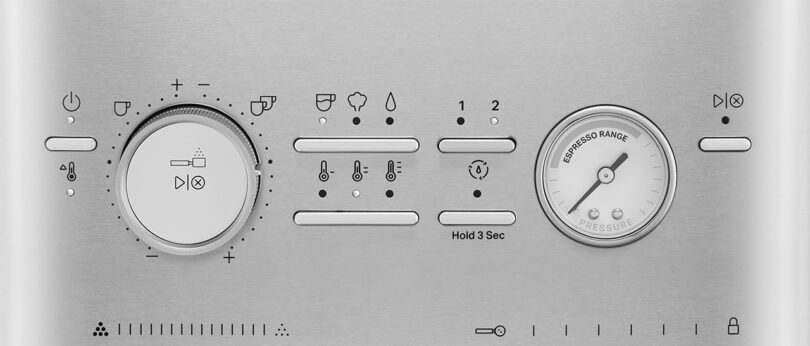 Control panel of a KitchenAid Espresso Collection appliance with dials and indicator icons for temperature, pressure, and settings.