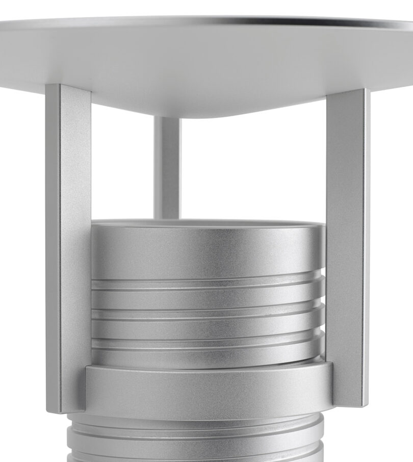 Detail of Modern adjustable metal table lamp with a cylindrical base.