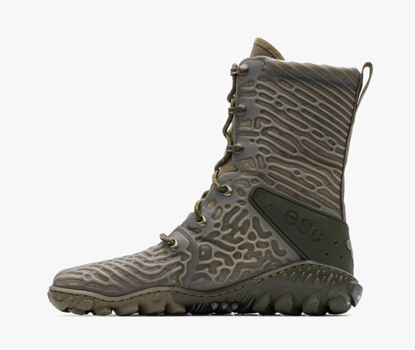 Vivobarefoot Jungle ESC boots with a high ankle design, unique contour patterns on the upper, and a thick, rugged sole.