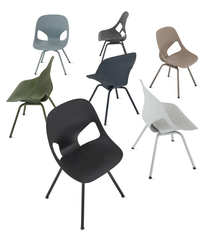 Seven modern ergonomic armchairs with a white background.