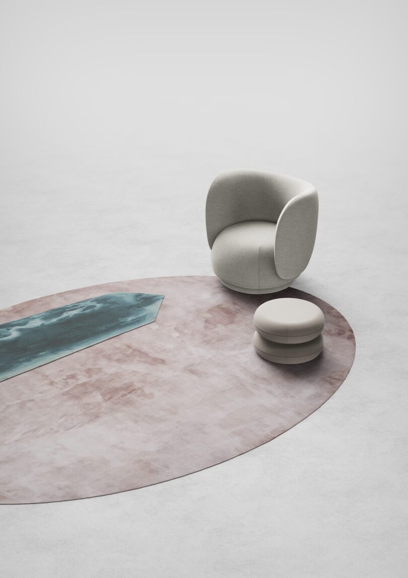 white sculptural chair and side table atop a rug made of a green obelisk and pink oval