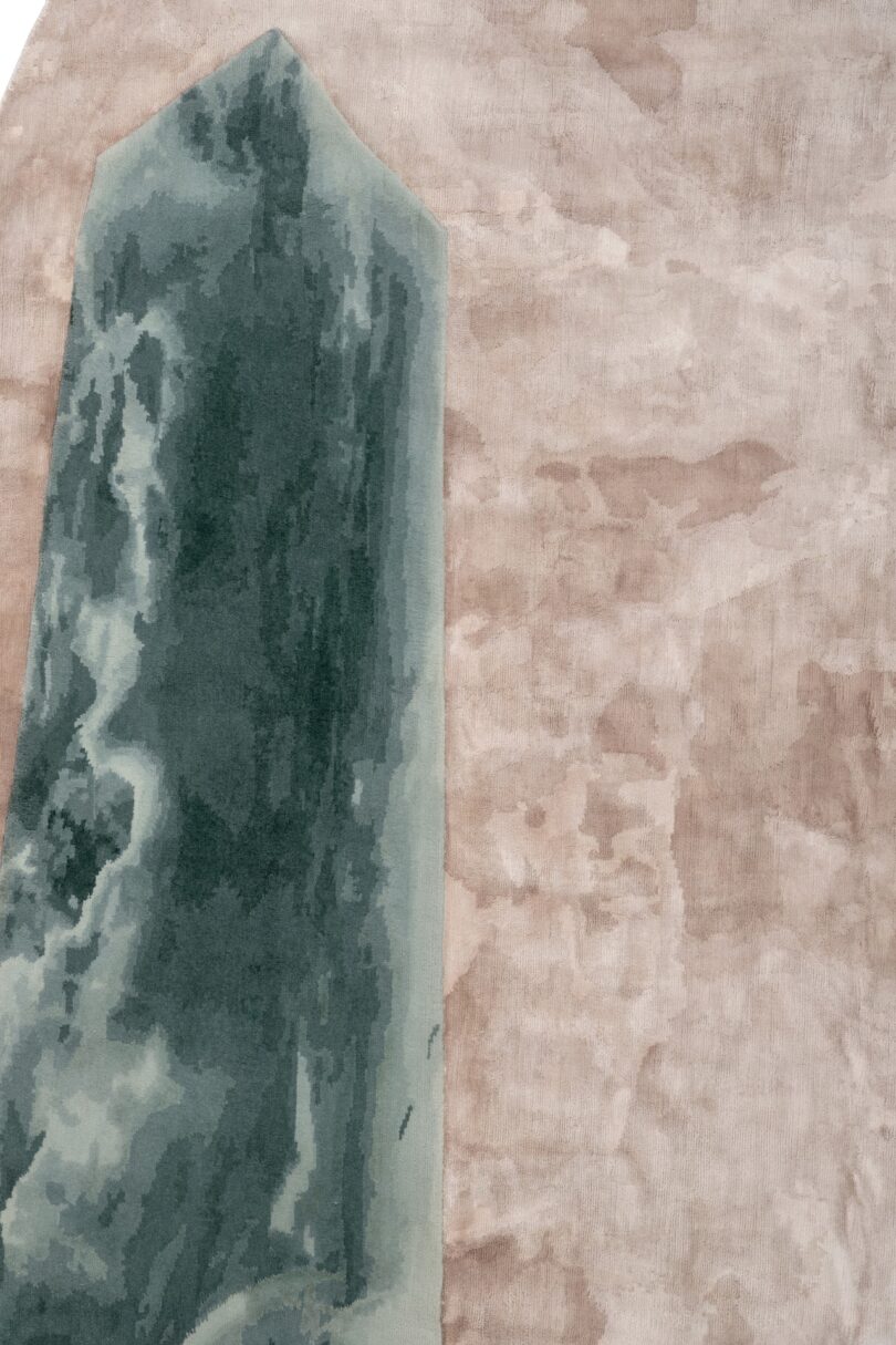 up close details of a rug made of a green obelisk and pink oval