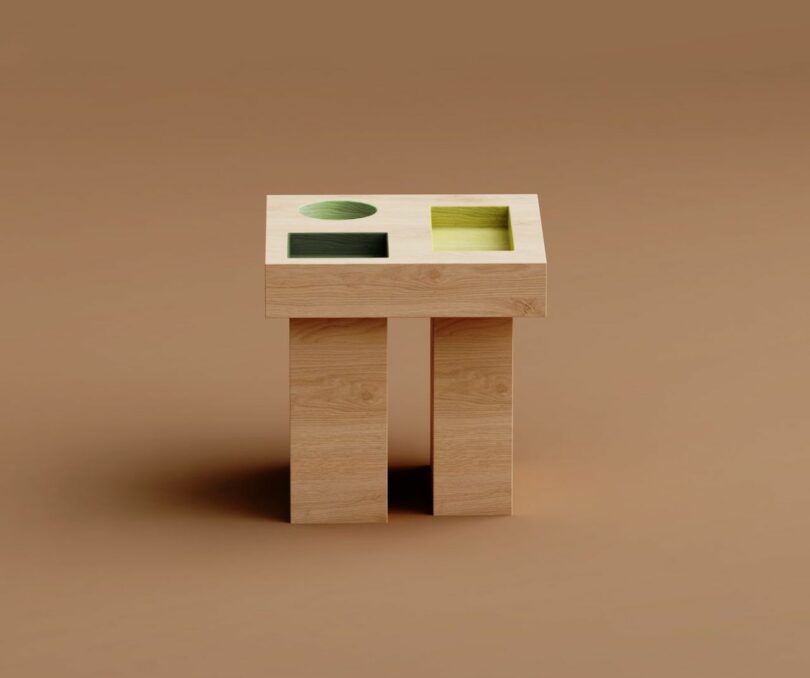 square wood side table with colorful geometric cut outs on a brown background
