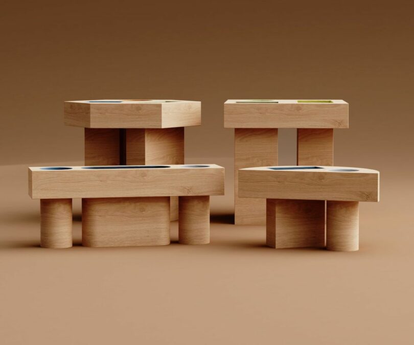 four wood side tables with colorful geometric cut outs on the tabletop on a brown background