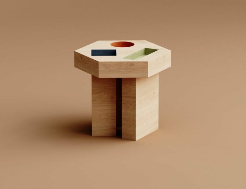 wood side table with colorful geometric cut outs on a brown background