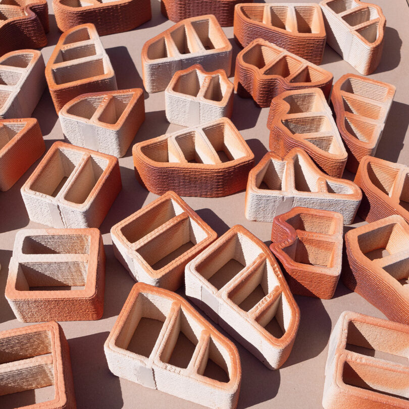 down view of an array of 3D printed white and red ceramic bricks
