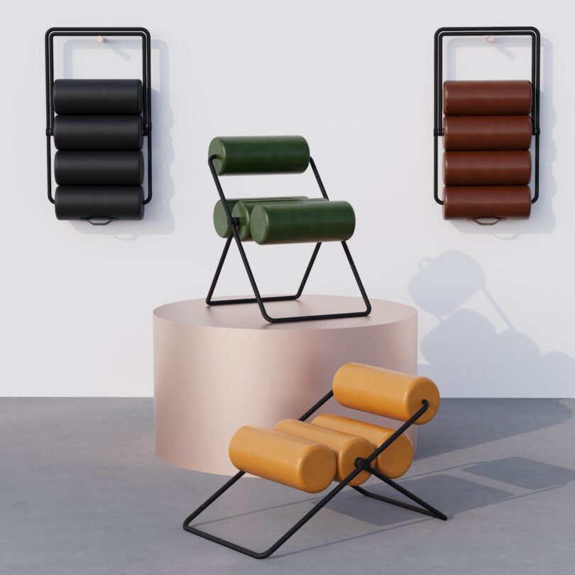 Three modern chairs with cylindrical cushions on metal frames, displayed in a minimalistic setting with two on wall mounts and one on a cylindrical pedestal