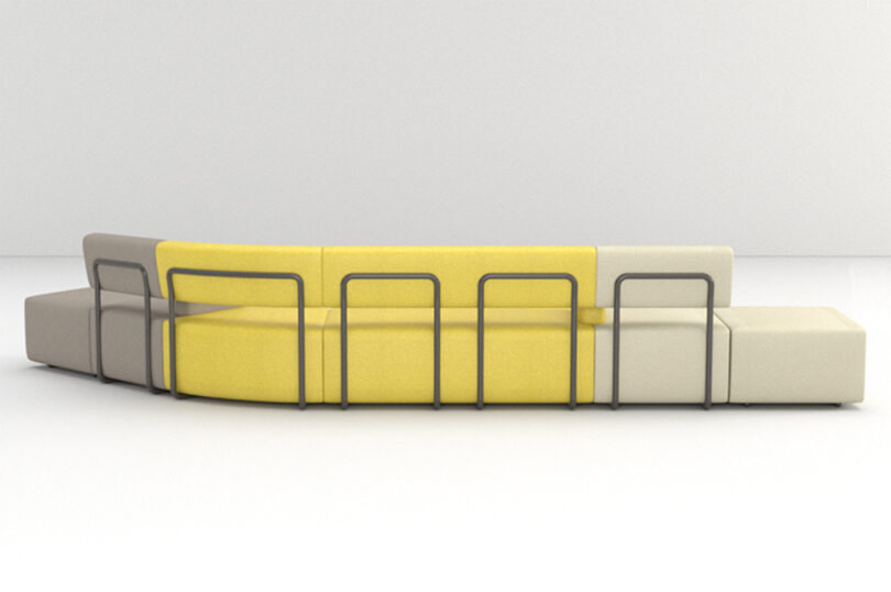 A modular sofa with yellow, white, and beige cushions, surrounded by a black metal frame.