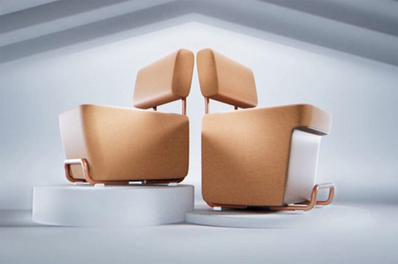 Two modern brown modular chairs positioned back-to-back on a white circular platform.