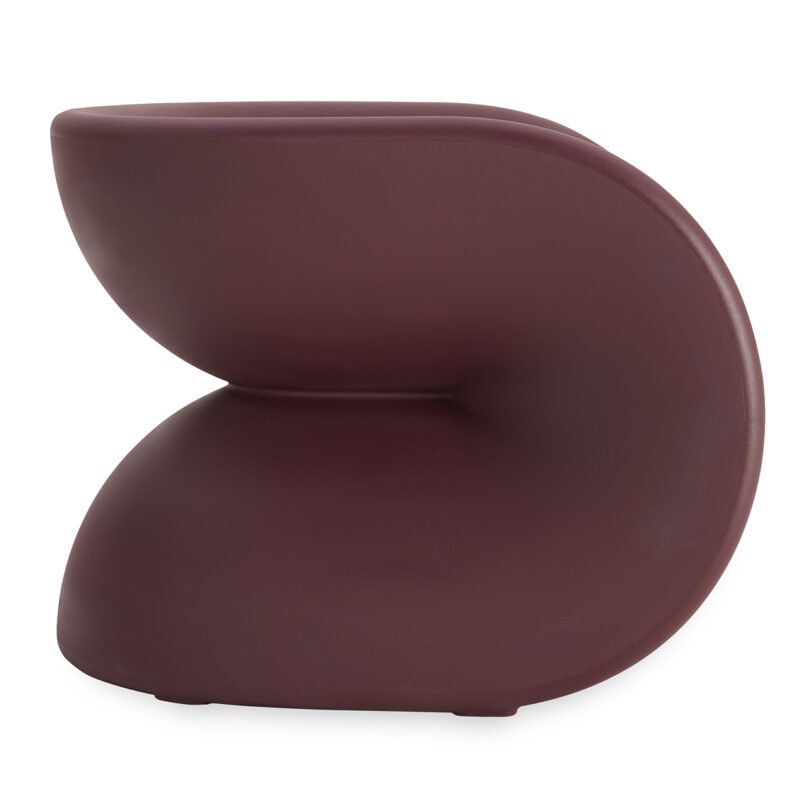 A modern maroon chair with a curved, sculptural shape on a white background.