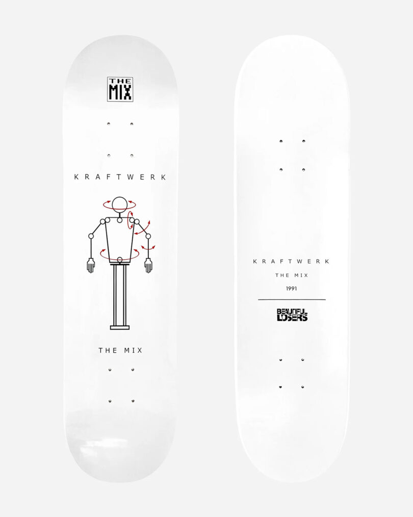 Two white skateboard decks featuring artwork and text for Kraftwerk's "The Mix." One board showcases an illustration of a robot dance moves, while the other includes text such as "Kraftwerk," "The Mix," and "1991." Part of the exclusive Kraftwerk Collection Skateboard Decks.