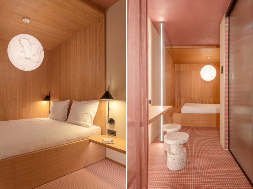 A modern hotel room features a wooden interior, a bed with white linens, a spherical pendant light, and minimalist furniture including a small desk with stools and a sliding door—all reflecting the innovative touch of MM:NT Berlin Lab.