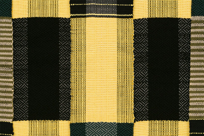closeup of yellow and black woven textile art