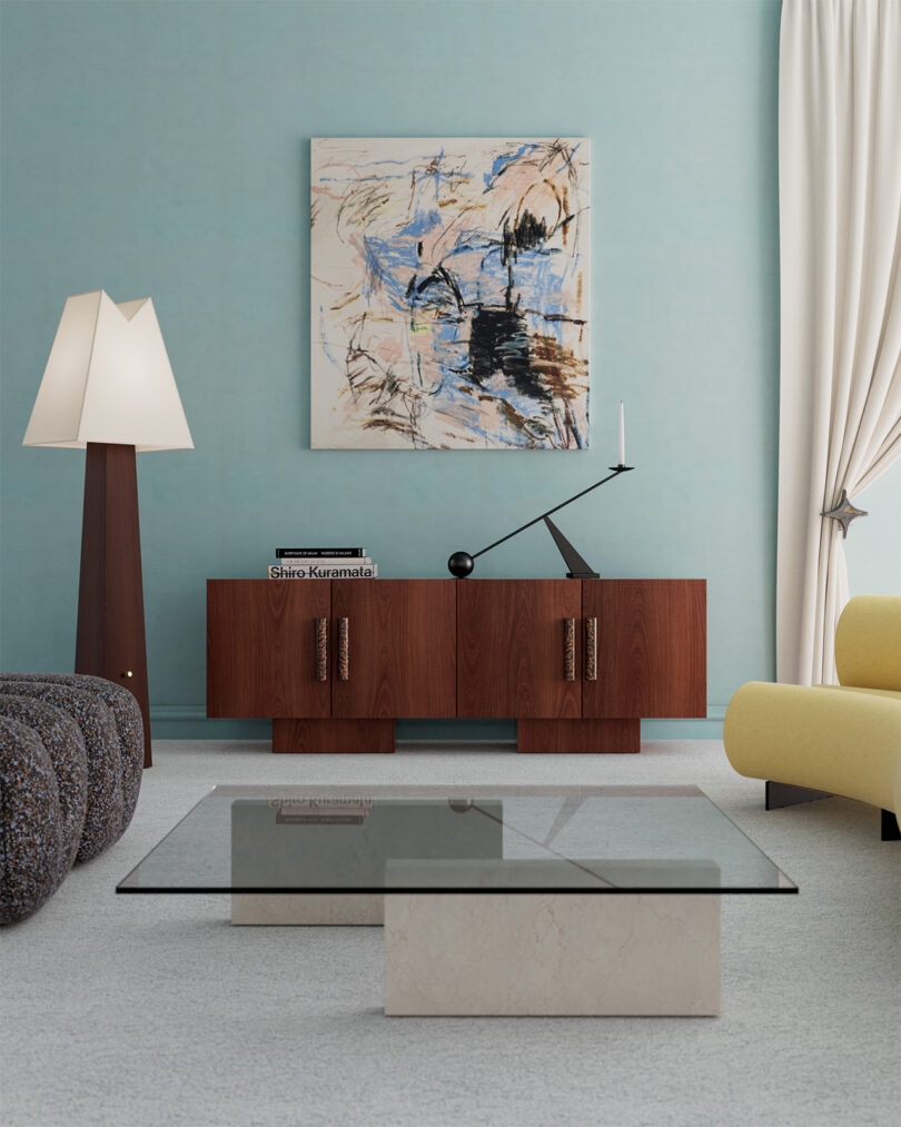 A living room with a wooden credenza, abstract wall art, modern floor lamp, yellow sofa, grey chair, and glass coffee table.