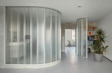 A Sculptor's Apartment With Curved Translucent Glass Walls + No Doors