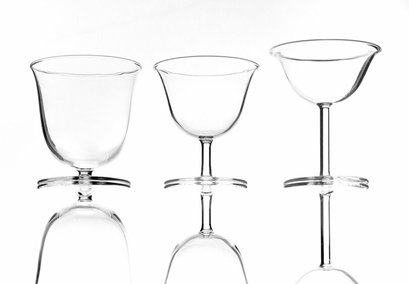 three-piece set of stemmed glassware with reflections at the bottom