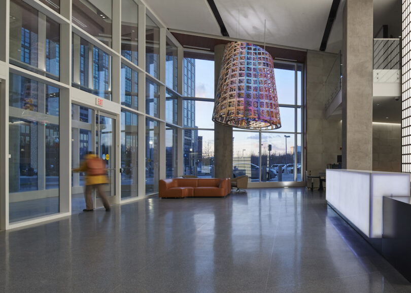 a lobby featuring a colorful public art installation made of metal panels