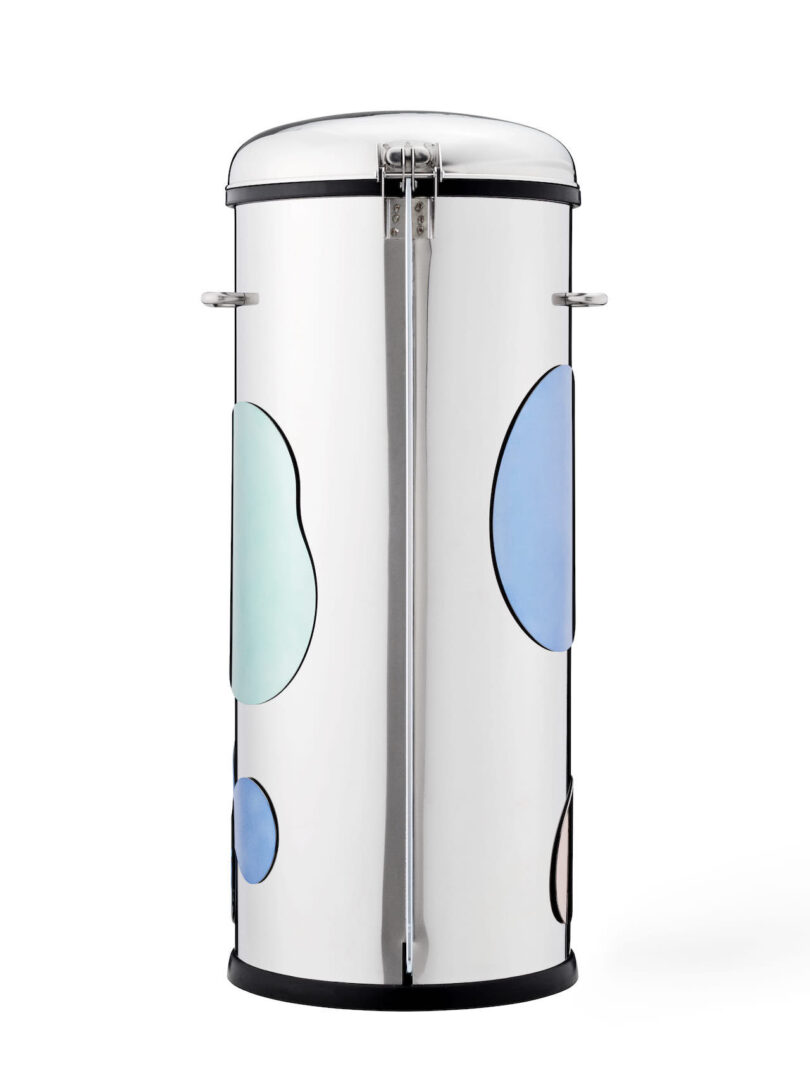 tall cylindrical steel trash can with various magnetic shapes attached to it