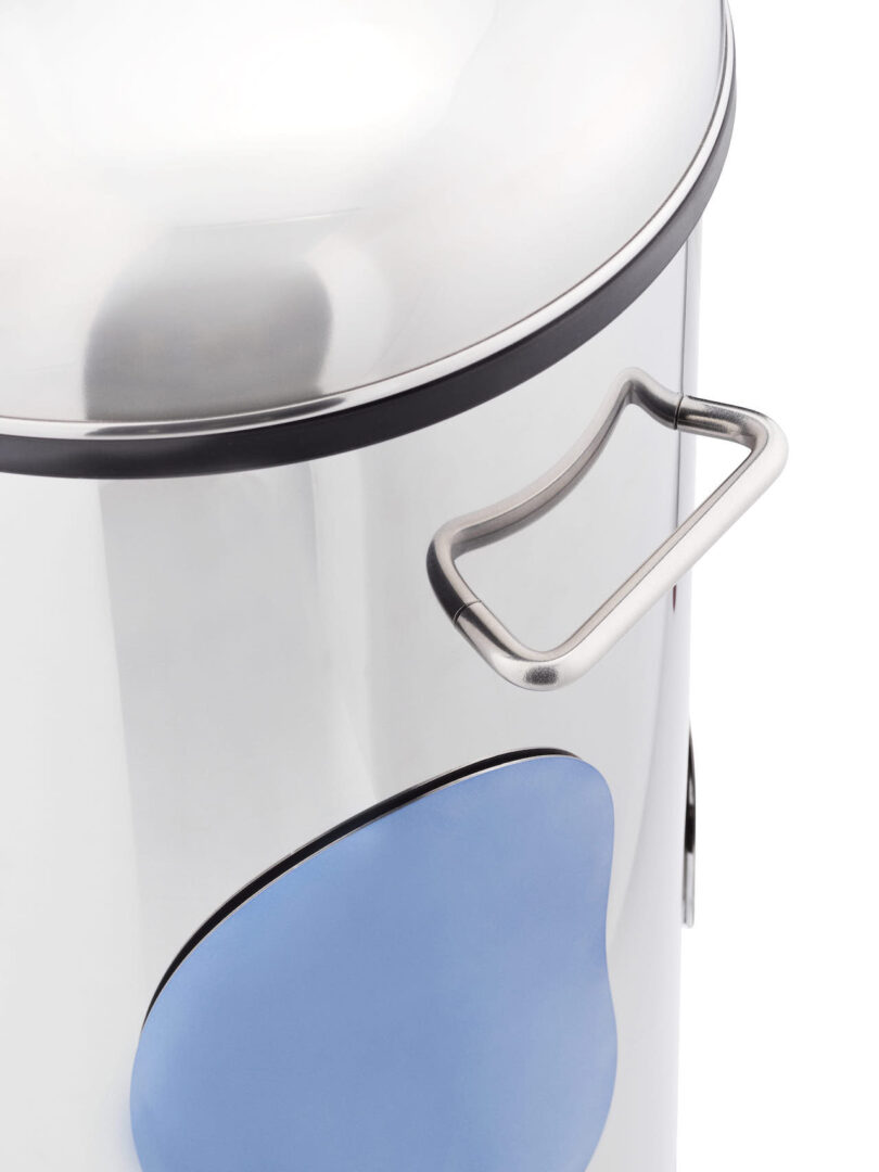 details of a tall cylindrical steel trash can with various magnetic shapes attached to it and a handle