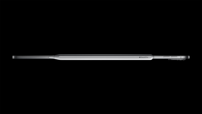 Side-top view of the Apple iPad Pro showcasing its slim profile against a black background, wit new Apple Pencil Pro attached along its top.