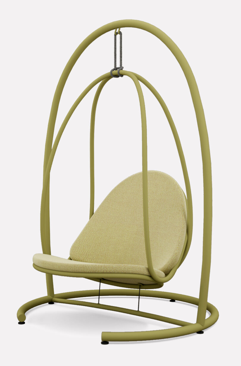 A cushioned hanging chair is suspended by a curved metal frame.