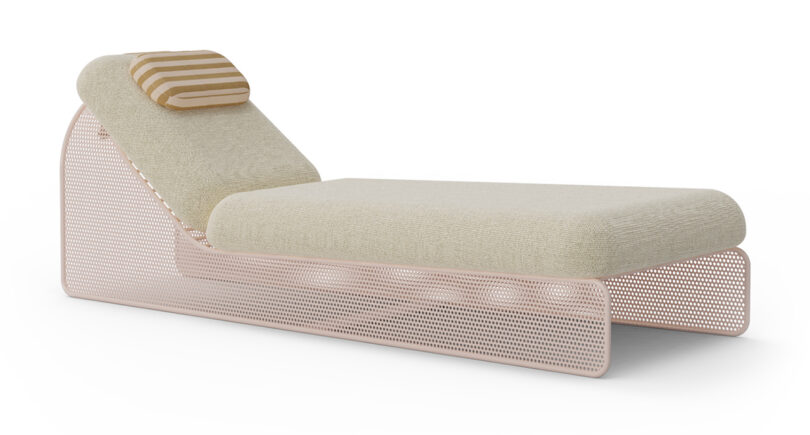 A beige daybed with a striped pillow and a perforated metal base.
