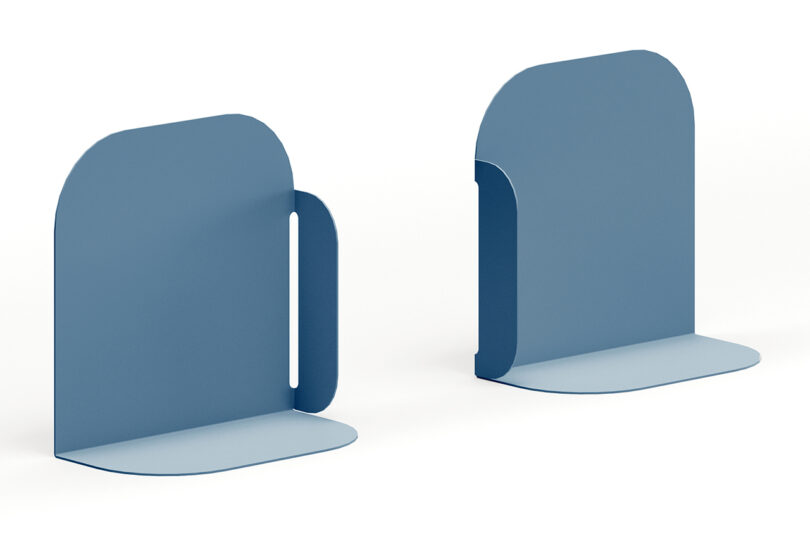 Two blue metal bookends by Fantin with a minimalist design, featuring rounded edges and smooth surfaces, positioned side by side against a white background.
