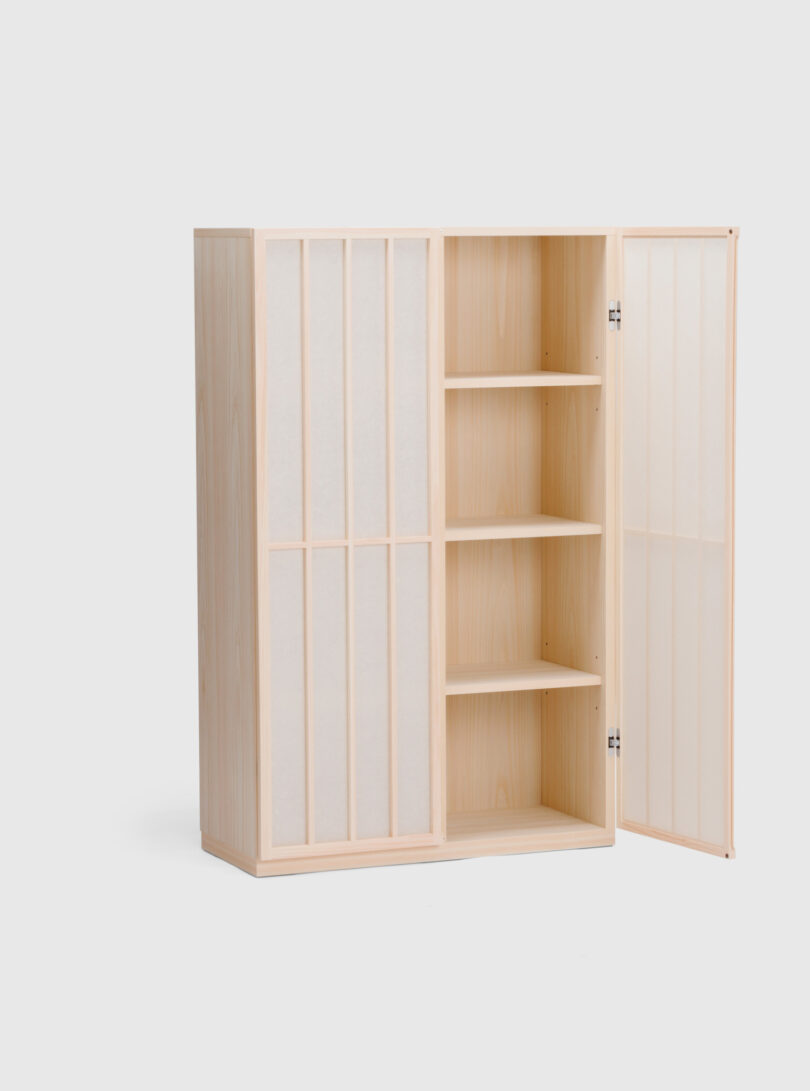 A wooden cabinet with a minimalist design, featuring paper-covered sliding doors, three interior shelves, and an open section with a hinged door partially open