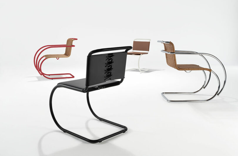 Four modern cantilever chairs with distinct designs, featuring metal frames and diverse seat materials, are displayed against a plain white background. They vary in colors including red, black, and neutral tones.