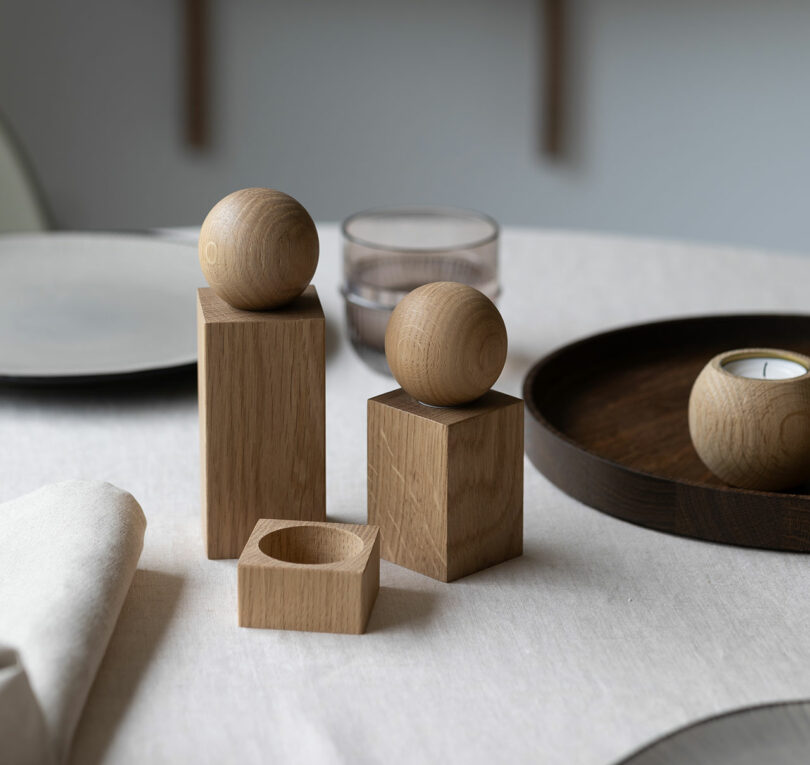 two wooden sculptures on a dining table